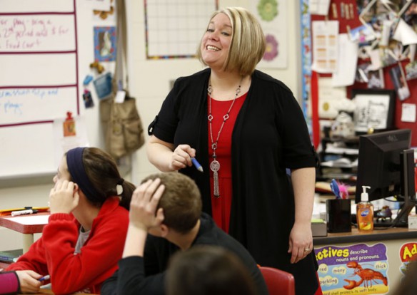 Holly Pitts teaches prepositions to her 7th-grade language arts class at Beechwood High School (Beechwood Independent). Pitts flips her classroom and has students watch short videos at home to aid in instruction. Photo by Amy Wallot, Feb. 13, 2013