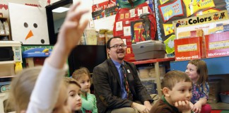 Principal Steve Jenkins participates with the kindergarten students during calendar time in Angie Taulbee's class at Trapp Elementary School (Clark County). Photo by Amy Wallot, Feb. 21, 2013