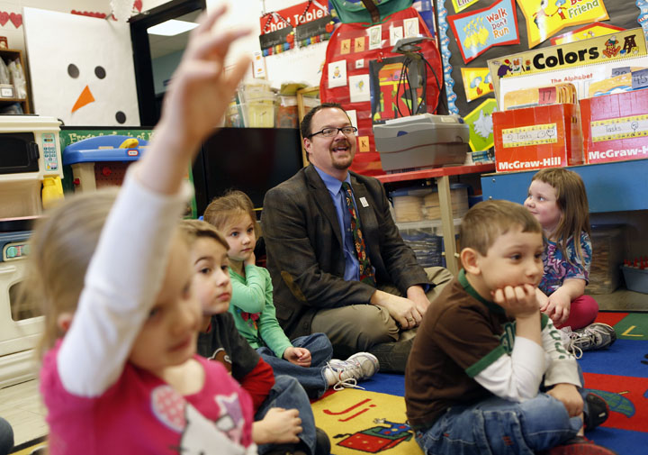 Principal Steve Jenkins participates with the kindergarten students during calendar time in Angie Taulbee's class at Trapp Elementary School (Clark County). Photo by Amy Wallot, Feb. 21, 2013