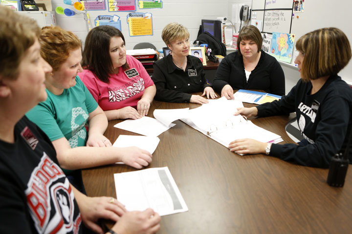 Kindergarten teacher Susan Burgess, 3rd-grade teacher Jenna Colson, special education teacher Charisse LaBoyteaux, 5th-grade teacher Gayla Routt, 2nd-grade teacher Krystal Miller and Principal Amily Campbell review data at Heartland Elementary School (Hardin County). They are all Pivotal Leadership participants. Each grade level at the school has a teacher participating in the program. Photo by Amy Wallot, March 15, 2013