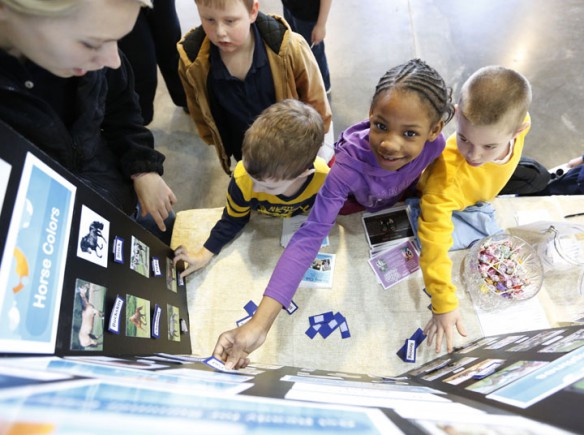 Toliver Elementary School (Danville Independent) students in Ron Ballard's 2nd-grade class play a matching game at a booth for the Meadow Lake Equestrian Center. Photo by Amy Wallot, March 27, 2013