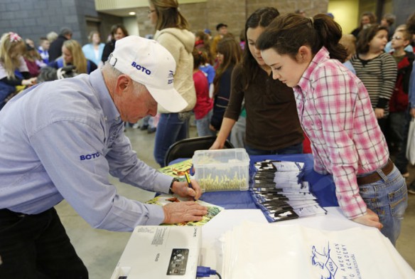 Hall of Fame jockey Chris McCarron signs his autograph for Owen County Middle School 5th-grade student Makayla Riggs. Photo by Amy Wallot, March 27, 2013