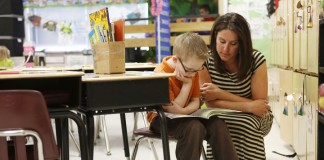 Amy Keadle listens to 1st-grade student Cooper Tuerk read during her class at Tilden Hogge Elementary School (Rowan County). Photo by Amy Wallot, April 8, 2013