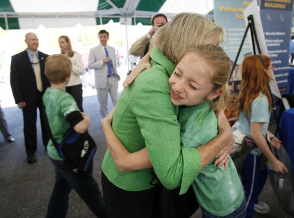 Northern Elementary School (Scott County) 4th-grade student Abby Flynn gets a hug from First Lady Jane Beshear after her school is named a National Green Ribbon School.