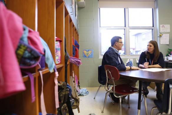 Rick Reinle and kindergarten teacher Kay Pence discuss student placement for next year at Taylorsville Elementary School (Spencer County). Pence said they work really closely together, reinforcing strategies each is using when working with students. Photo by Amy Wallot, May 6, 2013