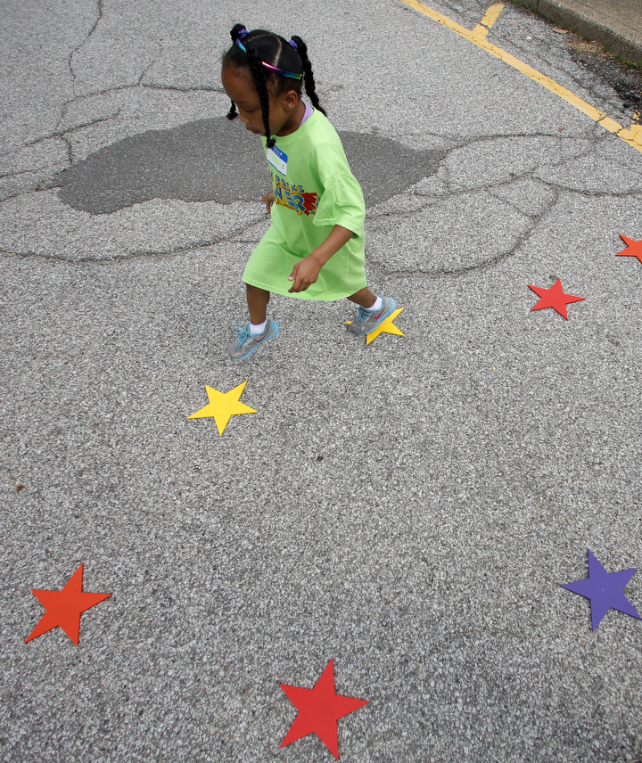 First-grade student Erika Marshall plays a game skipping and hopping from star to star. Photo by Amy Wallot, June 5, 2013