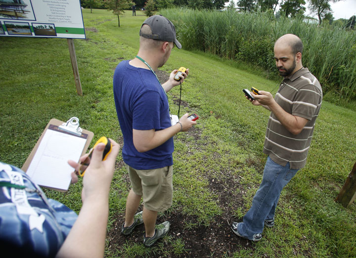 Frankfort High School geography teacher Shane Hecker compares his coordinates from a GPS unit to the ones from the Map My Run app during the Kentucky Geographic Alliance Summer GIS Institute. Photo by Amy Wallot, June 18, 2013