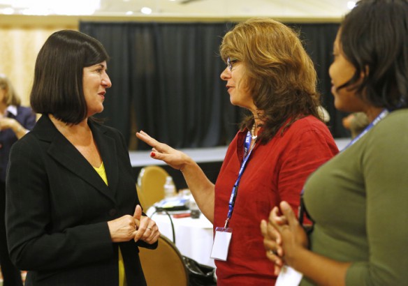 Director of Education, College Ready for the Bill and Melinda Gates Foundation Vicki Phillips, left, talks with Franklin-Simpson High School (Simpson County Assistant Principal Denise Reetzke during the Let's TALK conference on Louisville. Phillips mentored Reetzke when she first started teaching in the district. Also pictured at right is Franklin-Simpson Middle School math teacher Natalie McCutchen. Photo by Amy Wallot, June 20, 2013