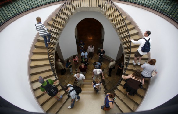 Teachers examine the self-supporting double staircase as they head upstairs to the House and Senate chambers. Photo by Amy Wallot, June 27, 2013