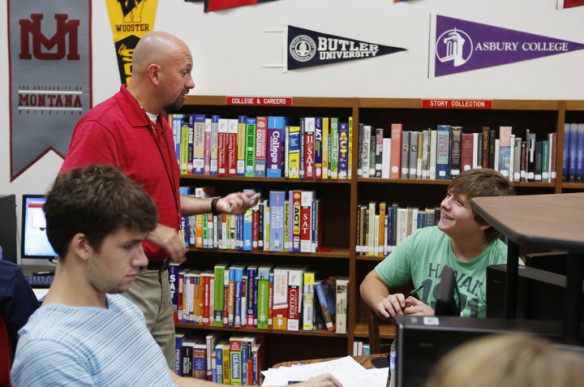 Counselor Chris Reeves talks with senior Robby Rundle about his essay for the Common App during College Application Boot Camp at Beechwood High School (Beechwood Independent). Rundle plans on studying criminal Justice. Photo by Amy Wallot, Aug. 6, 2013