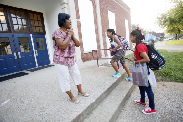 Director Tina Stevenson greets STEAM Academy (Fayette County) students as they arrive at school in the morning. Photo by Amy Wallot, Aug. 21, 2013