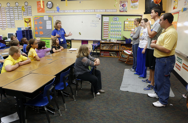 Fourth-grade teacher AJ Tabor introduces Caldwell County High School student athletes to her at Caldwell County Elementary School. Photo by Amy Wallot, Oct. 15, 2013