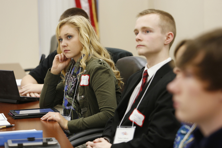 Next-Generation Student Council new members Karson Johnson and Nolan Calhoun listen as other members share experiences from their high schools during a Frankfort meeting. Photo by Amy Wallot, Oct. 30, 2013