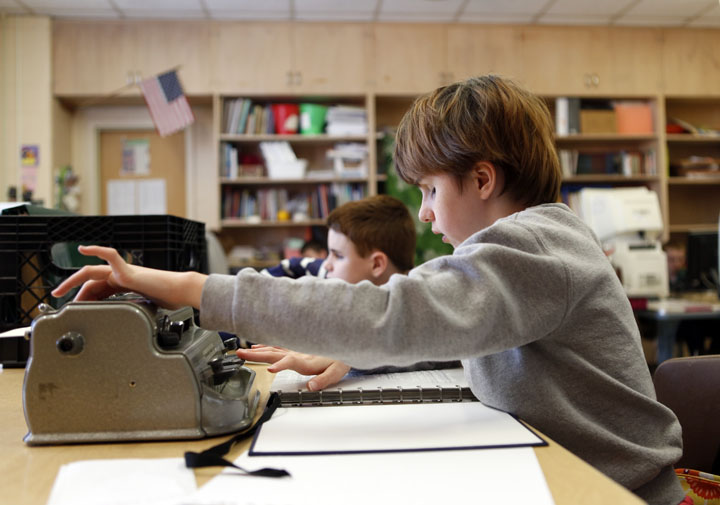 Kentucky School for the Blind 7th-grade student Heather Anthony uses a Braille typewriter while working on a poetry project. Funding for capital projects at KSB and the Kentucky School for the Deaf is a priority in the Kentucky Board of Education's legislative agenda. Photo by Amy Wallot, Dec. 11, 2013
