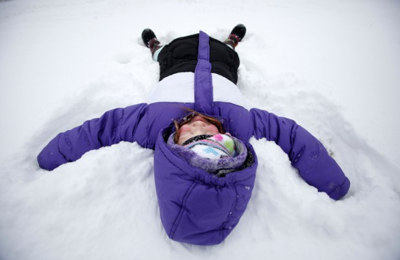 Hearn Elementary School (Franklin County) 1st-grade student Paige Barker makes a snow angel while sledding with her family. Photo by Amy Wallot, Jan. 21, 2013