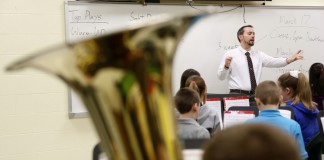 Shawn Robinson leads the middle school band during class. Robinson splits his time between three schools in the district.