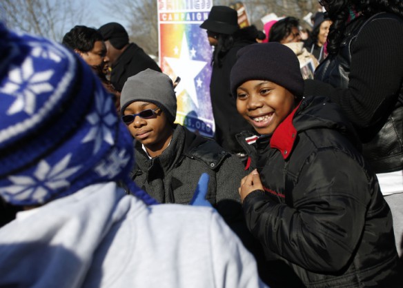 Vincent Adams, a Fayette County 6th-grade student in the Black Males Working program, laughed with friends while waiting for the speakers to begin during the 50th Anniversary Civil Rights March on Frankfort to the capitol steps. Photo by Amy Wallot, March 5, 2014