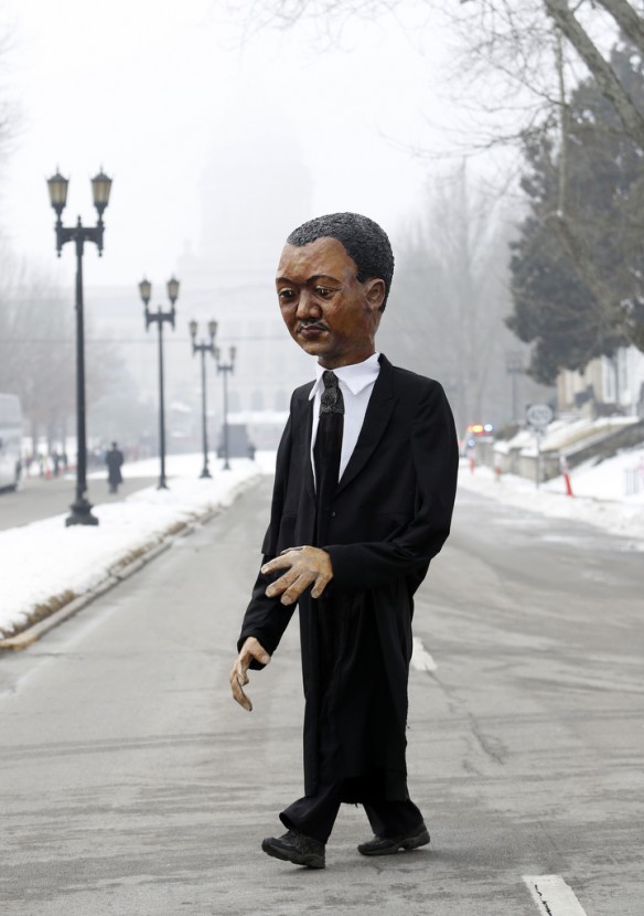 Shelby County resident Pat Greer worked a Dr. Martin Luther King, Jr. puppet before walking down Capitol Ave. for the 50th Anniversary Civil Rights March on Frankfort. King and baseball legend Jackie Robinson were among the original marchers. Photo by Amy Wallot, March 5, 2014