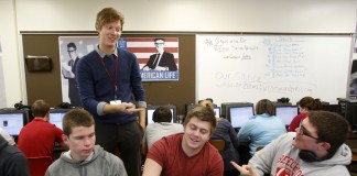 Journalism teacher Mike Piergalski guides seniors Jared Sletto, David Allen and Joe Macejko in writing a satire piece, similar to the style found in The Onion, at Beechwood High School (Beechwood Independent). “My journalism class allows for constant creativity, whether it’s in the form of blogging, podcasting or producing satirical pieces,” Piergalski said. Photo by Amy Wallot, Feb. 19, 2014