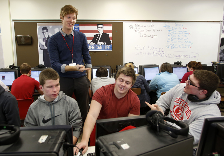 Journalism teacher Mike Piergalski guides seniors Jared Sletto, David Allen and Joe Macejko in writing a satire piece, similar to the style found in The Onion, at Beechwood High School (Beechwood Independent). “My journalism class allows for constant creativity, whether it’s in the form of blogging, podcasting or producing satirical pieces,” Piergalski said. Photo by Amy Wallot, Feb. 19, 2014