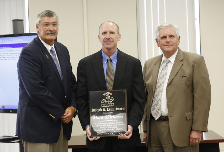 Kentucky Board of Education Chairman Roger Marcum and Commissioner Terry Holliday present the Joseph W. Kelly Award to Mark Shirkness. Photo by Amy Wallot, June 4, 2014
