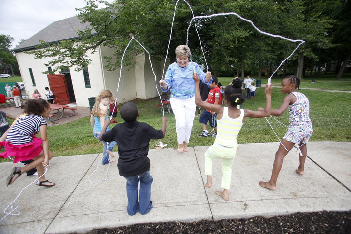 Deanna Tackett, Director of the Division of School and Community Nutrition for the Kentucky Department of Education, jumps rope with kids before lunch. Photo by Amy Wallot, June 11, 2014