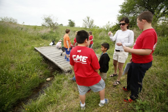 Science teacher Christy Johnson instructs 2nd-and 4th-grade students how to take water samples from a stream and test it for various nutrient levels at Glenn Marshall Elementary School (Madison County) Photo by Amy Wallot, May 9, 2014