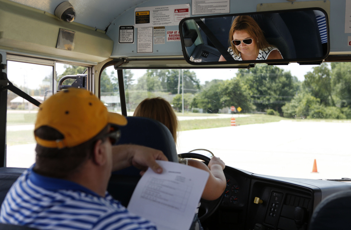 Program Consultant John Wyatt monitors Amber Brown as she navigates the course during the driver trainer instructor training at Franklin County High School.