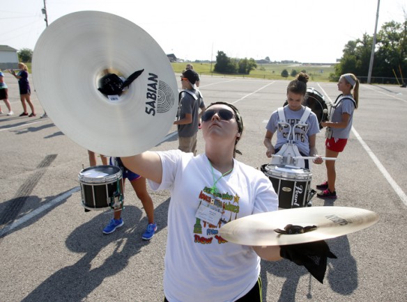 Freshman Haley Varney practices the cymbals. Photo by Amy Wallot, July 29, 2014