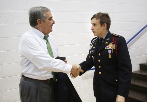 JROTC student Dennis Kerley invites Lt. Gov. Jerry Abramson to be a guest speaker at the military ball. Photo by Amy Wallot, Oct. 7, 2014