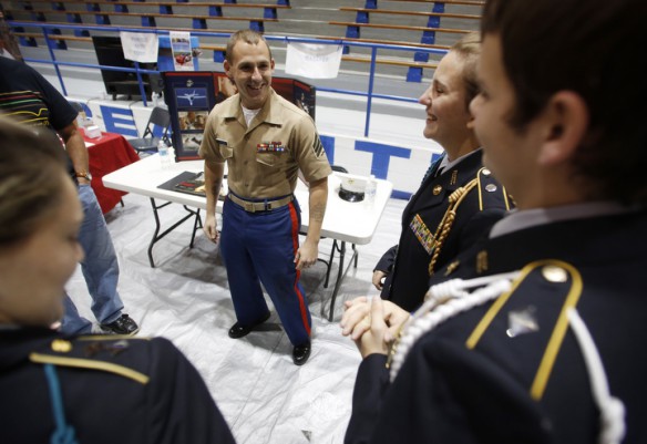 Marine recruiter Sgt. James Pardue and members of the Breathitt County JROTC share what the different patches and pins represent on their uniforms. Photo by Amy Wallot, Oct. 7, 2014