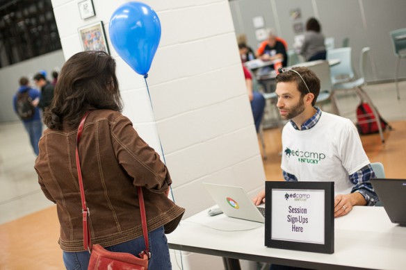 Eminence Elementary School (Eminence Independent) 5th-grade teacher Donnie Piercey checks-in Johnna Scogin, a Scott County teacher, during the EdCamp Kentucky conference in Bardstown. Photo by James Allen/Oldham County Schools, Oct. 25, 2014