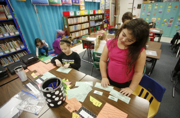 Second-grade students Allie Grubb and Georgia Banfield match numbers with their visual representations during Amy Orberson's class at at Woodlawn Elementary School (Boyle County). Photo by Amy Wallot, Dec. 2, 2014