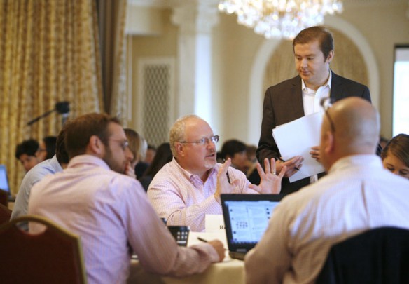 Rowan Claypool, center, founder of Teach Kentucky, makes a point during a discussion at the Kentucky Teach to Lead Leadership Summit in Louisville. Photo by Mike Marsee, Dec. 6, 2014