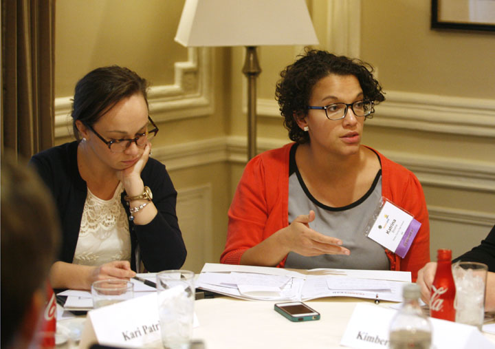 Katrina Boone, right, an English teacher at Shelby County High School, discusses her team's proposal during the Kentucky Teach to Lead Leadership Summit in Louisville as Kari Patrick, another English teacher at Shelby County who was part of her team, listens. Photo by Mike Marsee, Dec. 6, 2014