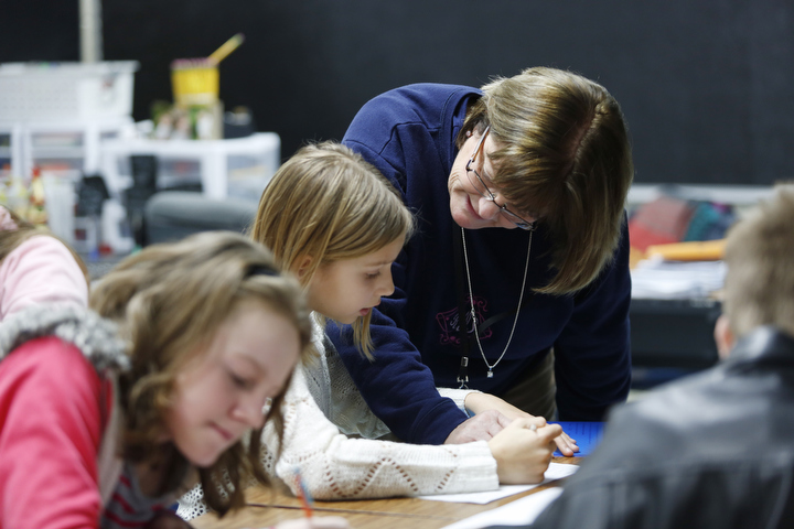 Rhonda Orttenburger works with students at Kit Carson Elementary School (Madison County). Photo by Amy Wallot, Dec. 9, 2014