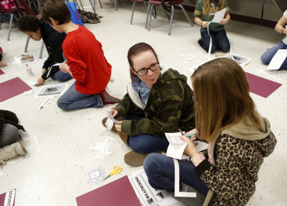 Sixth-grade students Cameron Anderson and Kaydence McCormick create a definitions poster during Sunni Ogg's class at South Livingston Elementary School (Livingston County). Photo by Amy Wallot, Dec. 11, 2014