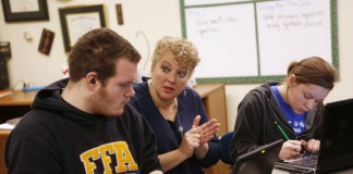 Lee Alan Roher works with juniors Jeffery Carter and Brianna Jones on adding and subtracting complex numbers at the Kentucky School for the Deaf. Photo by Amy Wallot, Jan. 15, 2015