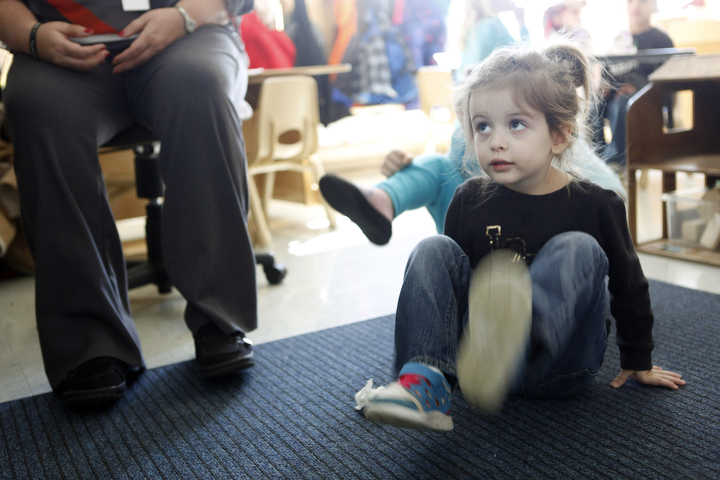 Bella Howard stomps her feet to a song about the days of the week during preschool class at Morganfield Elementary School (Union County). Photo by Amy Wallot, Jan. 28, 2015