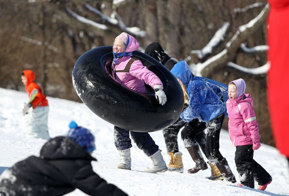 Students from Liberty Elementary School (Fayette County) head back up the snow hill at Stonewall Elementary School (Fayette County).