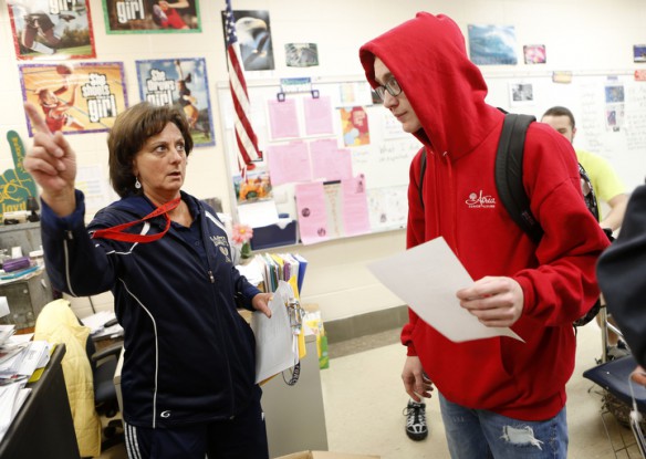 Rhonda Smith instructs junior Zach Ackman on how to get started with the fitness scavenger hunt at Lloyd High School (Erlanger-Elsmere Independent). Photo by Amy Wallot, Feb. 24, 2015