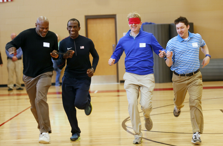 James Alcorn, a physical education teacher at Ashland Elementary (Fayette County) and Paralympic athlete Lex Gillette race Stephen McCauley, a physical education teacher at Paris High School (Paris Independent) and Brian Newton, a special education teacher at George Rogers Clark High School (Clark County) during the Adaptive Sports and Curriculum for Physical Education professional development.