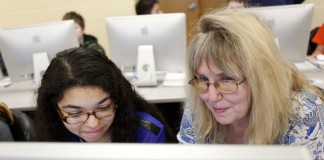 Science teacher JoAnn Hall helps 7th-grade student Caitlin Wels explore careers in the business field as part of her ILP at Hazard Middle School (Hazard Independent). Photo by Amy Wallot, March 10, 2015