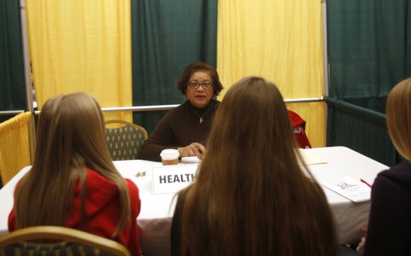 Mary Fields, a retired nurse from Kentucky State University, talks with Anderson County Middle School students about careers in health sciences during Operation Preparation at KSU. Photo by Amy Wallot, March 11, 2015