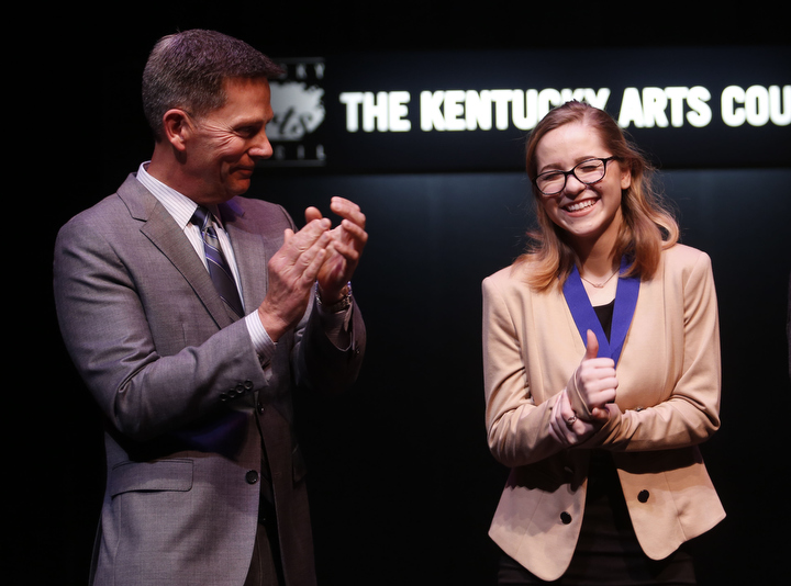 Tourism, Arts and Heritage Cabinet Deputy Secretary Lindy Casebier congratulates state champion Haley Bryan at the Poetry Out Loud Kentucky State Finals in Frankfort. Photo by Amy Wallot, March 12, 2015