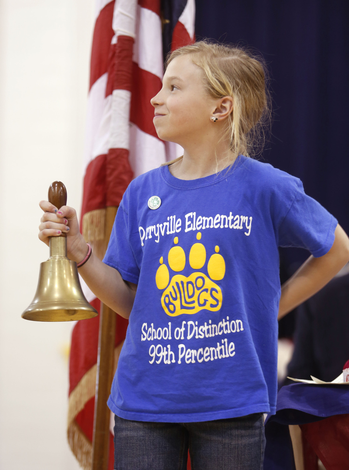 Perryville Elementary School (Boyle County) student council president Reagan Maddox rings a bell four times, once for each year of the Civil War. Photo by Amy Wallot, April 9, 2015