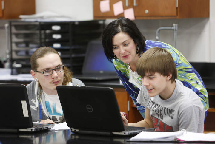 Stephanie Harmon works with seniors Calan Cromer and Jacob Witten as they research volcanoes during earth science class at Rockcastle County High School. Student engagement is a key component in Harmon’s classes, and she frequently shares her classroom experiences with other teachers in her role as a consultant.
