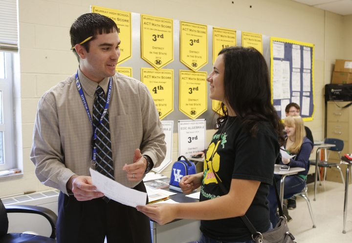 Justin Scott tells junior Zan Speed that her example of a quadric equation open response question was that first that has been turned into him with a distinguished score at Murray High School (Murray Independent). Photo by Amy Wallot, May 12, 2015