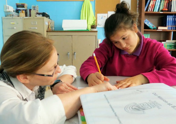 Science teacher Kristin Humphrey works with student Jasmine Cisneros at the Bullitt Alternative Center (Bullitt County), which was one of 11 programs in nine districts recognized this year as Alternative Programs of Distinction by the Kentucky Department of Education. Photo by John Roberts/Bullitt County Schools