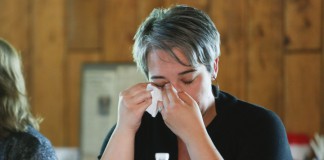 Sasha Reinhardt, a language arts teacher at Bath County Middle School, wipes a tear after learning about Irena Sendlerowa during "Social Justice-Centered Classrooms: A Writing and Thinking Retreat" at General Butler State Resort Park. Sendlerowa was a Polish woman who hid Jewish children during the Holocaust. Photo by Amy Wallot, June 25, 2015
